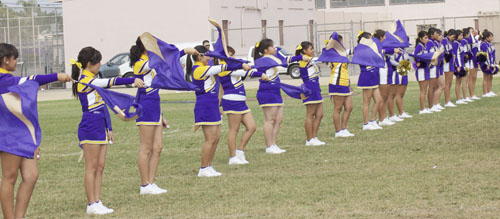 The short flag girls welcoming all the Bell teams.