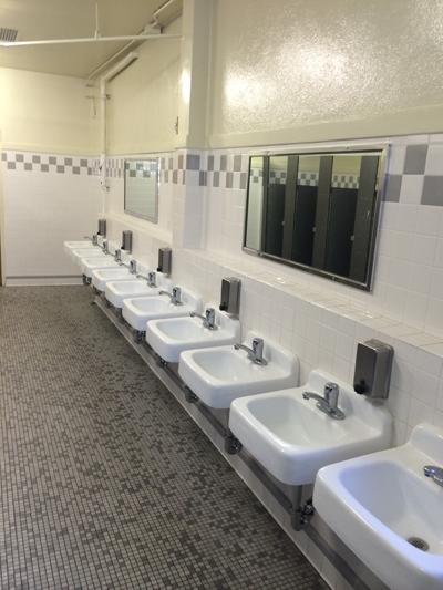 The sinks of the girls restroom in the auditorium