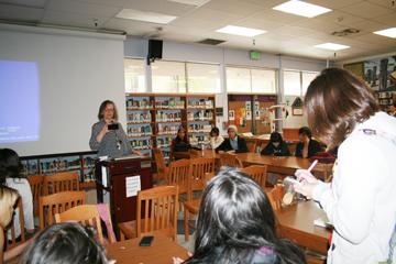 Reporter Alejandra Mendoza asks Ms. Hopkins questions. 