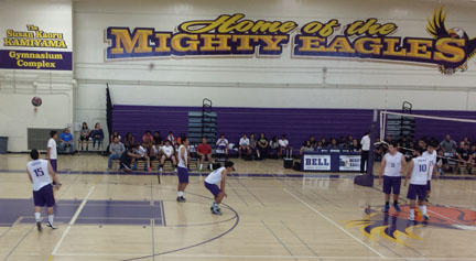 Ismael Esquievias, number 15, is ready to serve the ball during the pre-season match against Elizabeth Learning Center.