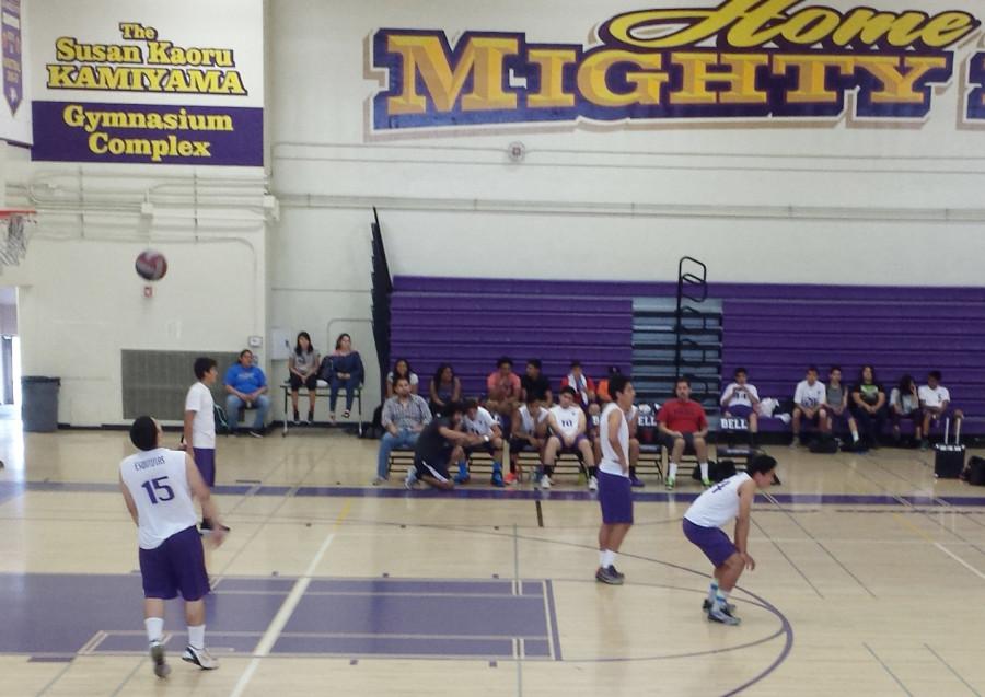 Ismael Esquievias, number 15, is ready to serve the ball during the pre-season match against Elizabeth Learning Center.