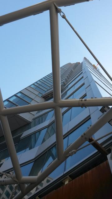 Looking up from inside of the site, the taller expanse of the building can be seen straying from tradition by incorporating curved edges instead of straight ones.