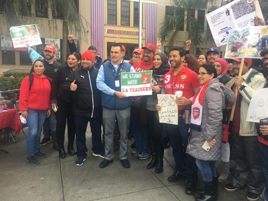 Bell teachers and staff strike in front of the school.  The LAUSD strike resulted in a pay increase for teachers, limits on class sizes and increases in librarian and nurse availability.